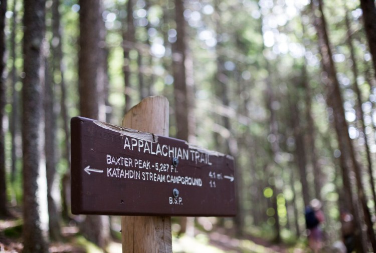 A sign post directs hikers on the Hunt Trail, a section of the Appalachian Trail and popular route to Baxter Peak on Katahdin. 