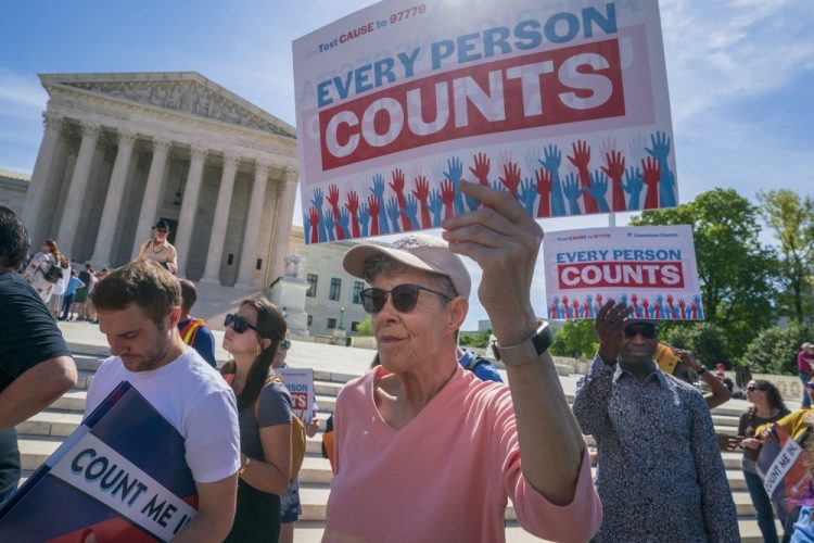 Immigration activists rally outside the Supreme Court as the justices hear arguments over the Trump administration's plan to ask about citizenship on the 2020 census, in Washington on April 23, 2019. The question won't be on the census, but states like Maryland, New York and Alabama are all pursuing citizenship-related court cases.