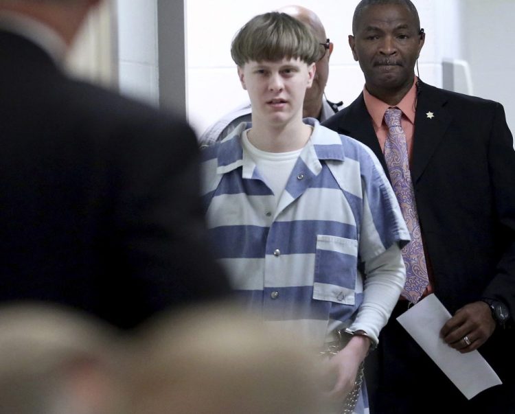 In this April 10, 2017, file photo, Dylann Roof enters the court room at the Charleston County Judicial Center to enter his guilty plea on murder charges in Charleston, S.C.  Roof on Tuesday appealed his federal convictions and death sentence in the 2015 massacre of nine black church members in South Carolina, arguing that he was mentally ill when he represented himself at his capital trial. 