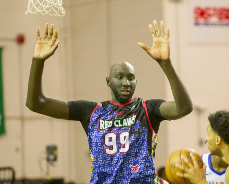 Tacko Fall of the Maine Red Claws defends a shot attempt by Ivan Rabb  of the Westchester Knicks on Friday at the Portland Expo.