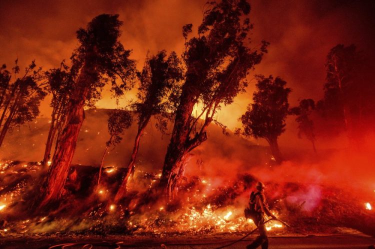 In this Nov. 1, 2019, file photo, flames from a backfire consume a hillside as firefighters battle the Maria Fire in Santa Paula, Calif. The decade that just ended was by far the hottest ever measured on Earth, capped off by the second-warmest year on record, NASA and the National Oceanic and Atmospheric Administration reported Wednesday.