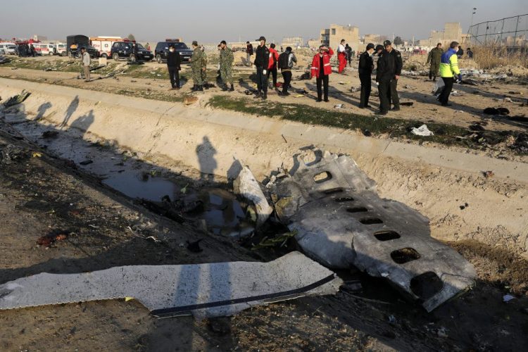 Debris from an Ukrainian plane which crashed as authorities work at the scene in Shahedshahr, southwest of Tehran. Iran announced Saturday that its military “unintentionally” shot down the Ukrainian jetliner that crashed earlier this week, killing all 176 aboard. 