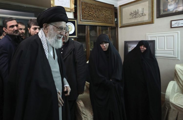 Iranian Supreme Leader Ayatollah Ali Khamenei meets with family members of Iranian Revolutionary Guard Gen. Qassem Soleimani, who was killed in the U.S. airstrike in Iraq, at his home in Tehran, Iran, on Friday. He has vowed retaliation and experts warn about possible cyberattacks.
