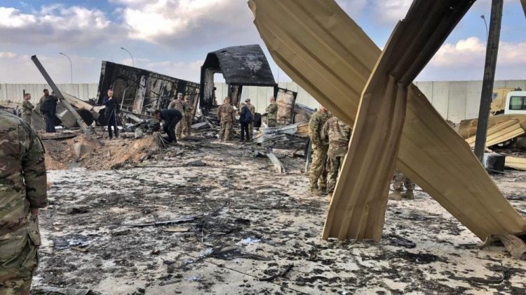 U.S. soldiers and journalists inspect rubble on Jan. 13 at the Ain al-Asad air base in Iraq, which was bombed by Iran on Jan. 8. The Pentagon said Friday that 34 U.S. service members suffered brain injuries in the attack.