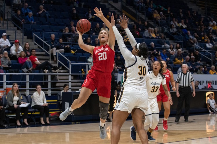 Boston University forward and Lawrence graduate Nia Irving goes up for a shot during a Dec. 7 game against the California Golden Bears in Berkeley, California. Irving recently scored her 1,000th point with the Terriers.