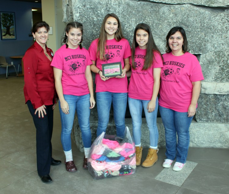Maine Central Institute Huskies Varsity Girls Soccer Team recently presented a check and knit hats to Brenda Farnham, MBA, BSN, RN, OCN, manager of nursing services, Northern Light Cancer Care. From left are Farnham, with students Kayla French, Danielle Dow, Katelyn French and Laurie Logiodice.