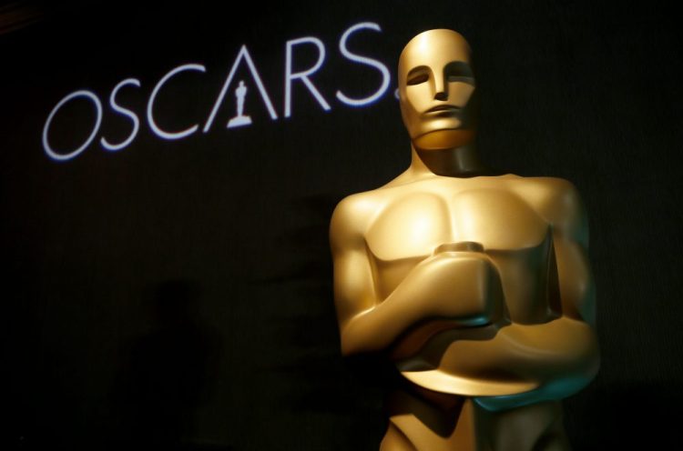 In this Feb. 4, 2019 file photo, an Oscar statue appears at the 91st Academy Awards Nominees Luncheon in Beverly Hills, Calif. The Oscars will not have a host for its annual awards show. 