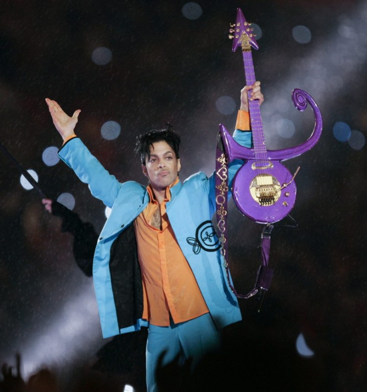 In this Feb. 4, 2007 file photo, Prince performs during halftime of the Super Bowl XLI football game in Miami. 