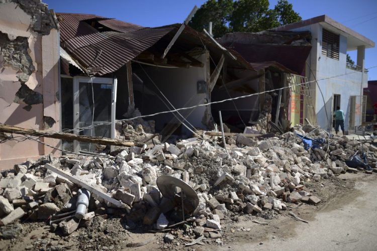 Homes are damaged after an earthquake struck Guanica, Puerto Rico, Tuesday, Jan. 7, 2020. 