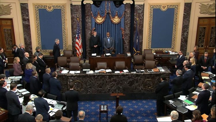 Senate chaplain Barry Black and Supreme Court Chief Justice John Roberts stand during the impeachment trial of President Trump in the Senate chamber at the U.S. Capitol in January.
A bipartisan group of former senators has written to the current Senate contends that the body has lost relevance over the past decade, particularly the past two years when the chamber has shied away from almost any contentious debate in favor of confirming President Trump's nominees to sub-Cabinet positions and the federal judiciary.