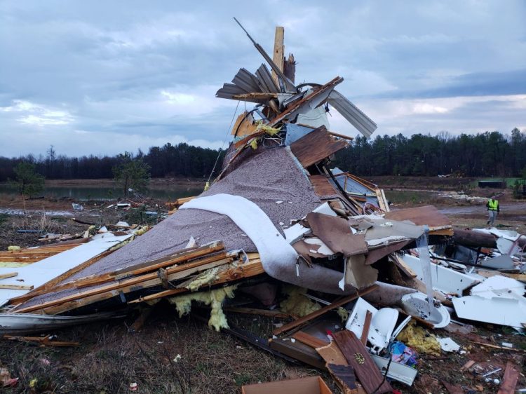 This photo provided by Bossier Parish Sheriff's Office shows damage from Friday night's severe weather, including the home of an elderly in Bossier Parish, La., on Saturday. The Bossier Parish Sheriff's Office said that the bodies of an elderly couple were found Saturday near their demolished trailer by firefighters. 