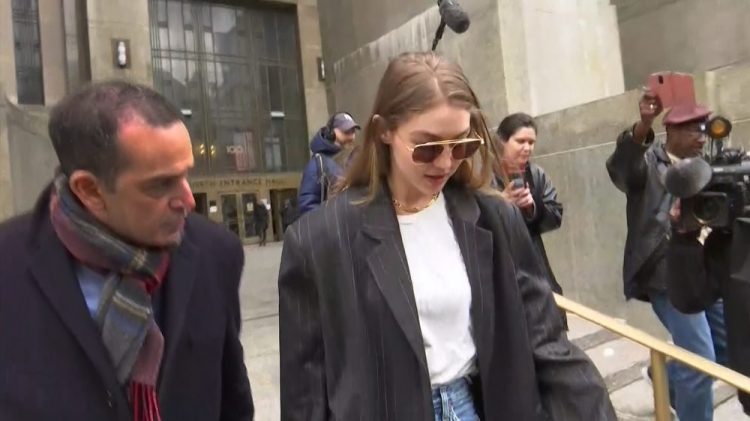 In this photo taken from video, super model Gigi Hadid walks out of a Manhattan court, Monday, Jan. 13, 2020, in New York. Hadid, who lives in Manhattan, turned heads Monday as part of the latest pool of 120 potential jurors summoned for Harvey Weinstein's rape trial. 