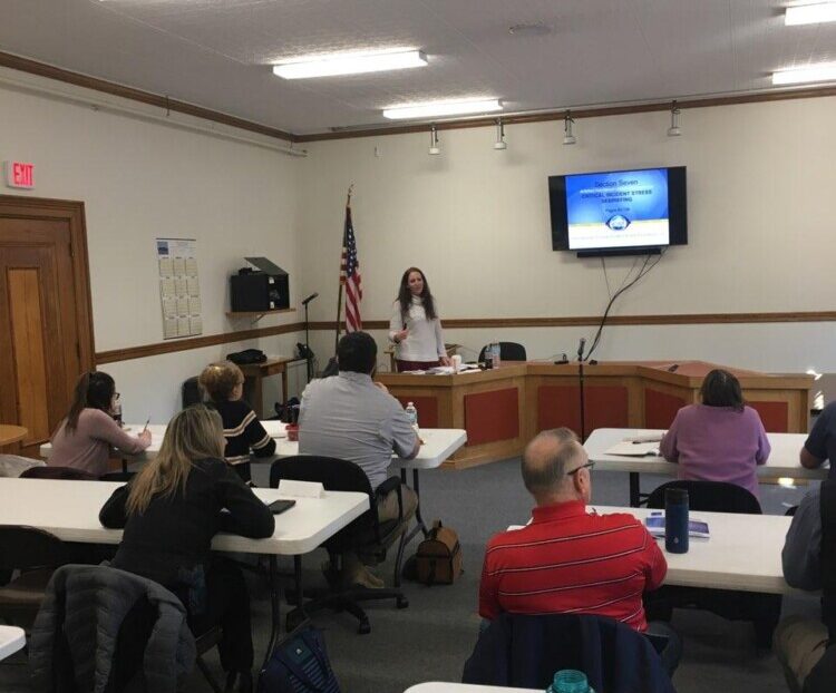 Police officers and mental health care providers attend a class this week in Skowhegan where they were trained in crisis intervention stress management. Hannah Longley, director of community programs at NAMI Maine, taught the course. 