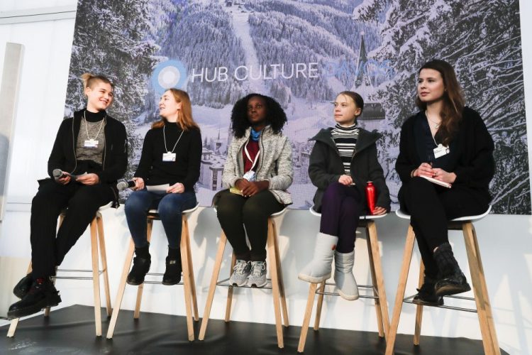 Climate activists Isabelle Axelsson, Loukina Tille, Vanessa Nakate, Greta Thunberg, and Luisa Neubaue,, from left, arrive for a news conference in Davos, Switzerland, Friday, Jan. 24, 2020. 