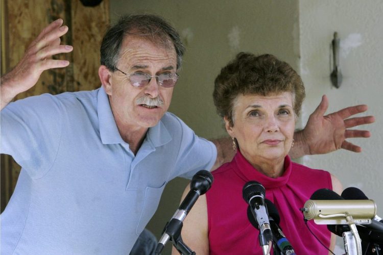 FILE - In this June 18, 2007, file photo, Ed and Elaine Brown talk to reporters during a news conference at their home in Plainfield, N.H., in 2007. Years after they were imprisoned for amassing an arsenal of weapons at their fortress-like home, and holding U.S. marshals at bay after a tax evasion conviction, Elaine Brown said she is ashamed of her actions and seeks a divorce while awaiting re-sentencing in 2020 in light of a recent U.S. Supreme Court ruling. 