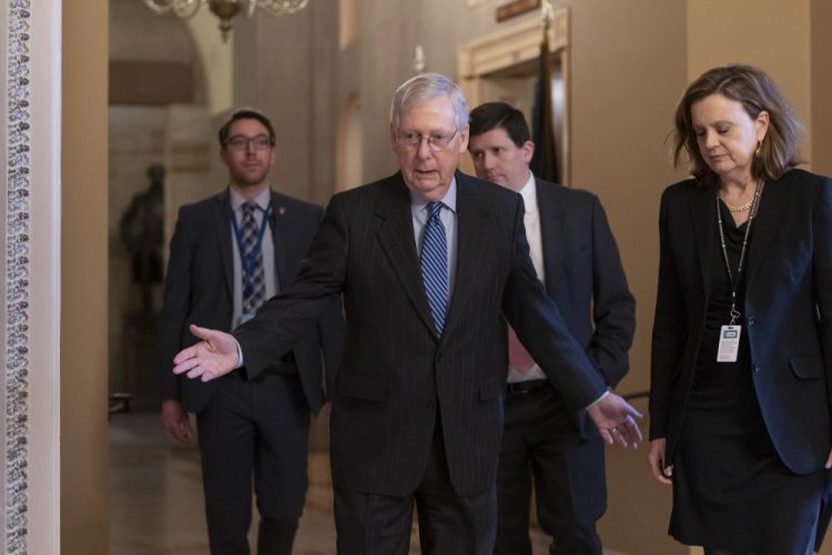 Senate Majority Leader Mitch McConnell, R-Ky., arrives for a closed meeting with fellow Republicans as he strategizes about the looming impeachment trial of President Donald Trump, at the Capitol in Washington, Tuesday.