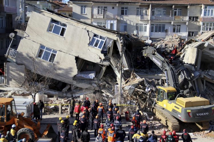 Rescuers work on a collapsed building after an earthquake struck in Elazig, Turkey, on Saturday. 