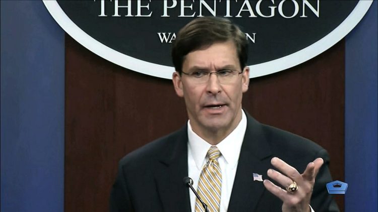 Secretary of Defense Mark Esper talks to the press on Iran and Iraq, Tuesday at the Pentagon. He justified the U.S. killing of Gen. Qassem Soleimani as an act of self defense, and he said the U.S. foresees no more Iranian military attacks in retaliation for that. 