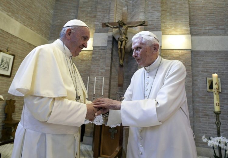 In this June 28, 2017, file photo, Pope Francis, left, and Pope Benedict XVI, meet each other on the occasion of the elevation of five new cardinals at the Vatican. 