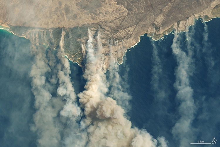 Burned land and thick smoke are visible on  Kangaroo Island, Australia, on Thursday. 