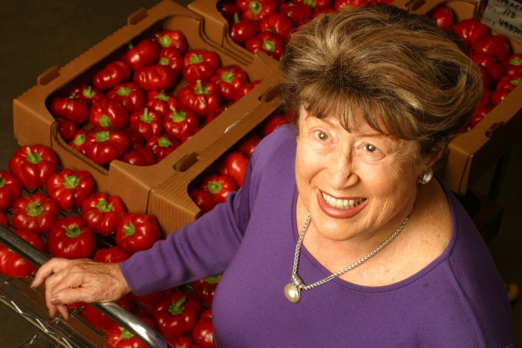 Frieda Caplan, shown here in 2003, displays the toma bella, a pepper and tomato hybrid. 