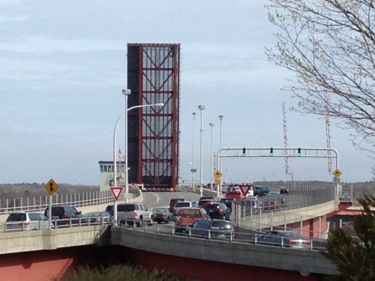 Traffic lines up as the Casco Bay Bridge opens for a passing ship.