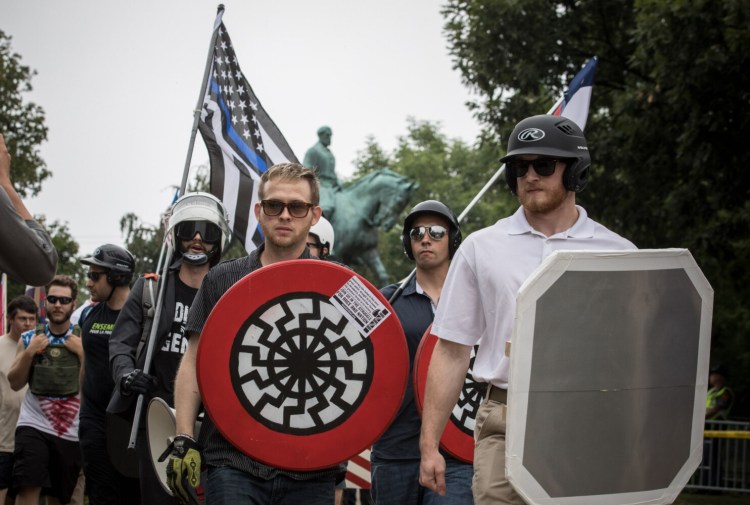 White nationalists rally at Emancipation Park in Charlottesville in 2017. Thousands are expected to show up for a gun-control protest on Monday in Richmond's Capitol Square. State and federal officials are preparing for a volatile mix of weapons, passions and anti-government fervor. 