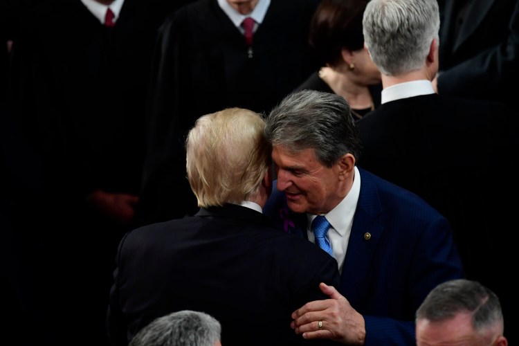 President Trump greets Sen. Joe Manchin, D-W.Va., after the 2018 State of the Union speech. Trump has interacted with Manchin more than any Democrat in the Senate. Manchin has come over for movie screenings and has been given tours by the president of the family residence and his private study.