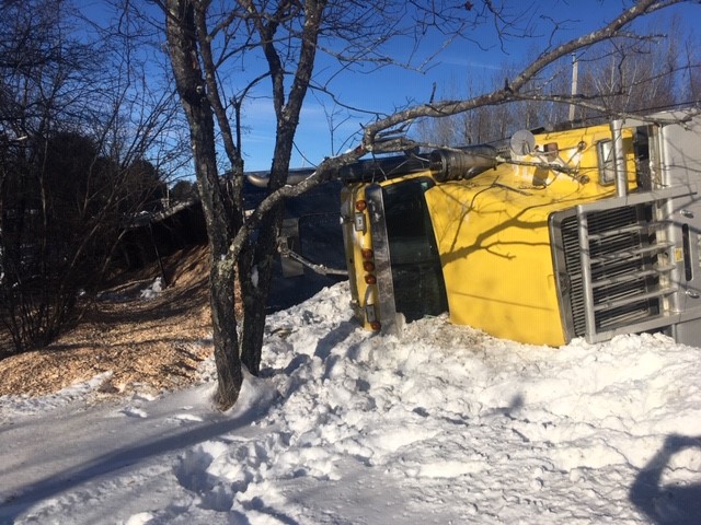 A fully loaded wood chip truck operated by Elwood Yeaton III, of Peru, rolled over on Route 150 in Athens on Monday and stayed on the side of the road for several hours waiting to be towed away. No one was injured in the crash.