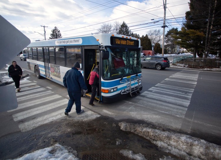 Passengers board a city bus on Main Street in South Portland. Some Portland-area officials say a lack of coordination among the seven agencies operating their own train, bus and ferry services in the region may be holding back future ridership gains.