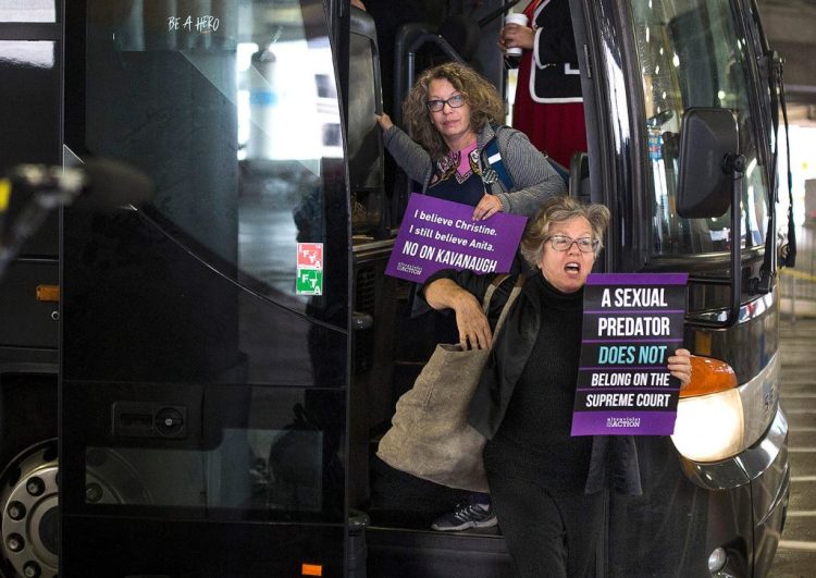 Susan Feiner, front, gets off a bus at Union Station in Washington, D.C., with a group of Mainers on Oct. 4, 2018. The group traveled from Maine in hopes of meeting with Sen. Susan Collins to voice opposition to then-Supreme Court nominee Brett Kavanaugh. Feiner, a retired USM professor, was later barred from teaching because she offered students a “pop-up” course for credit to take the bus to D.C. with demonstrators. 