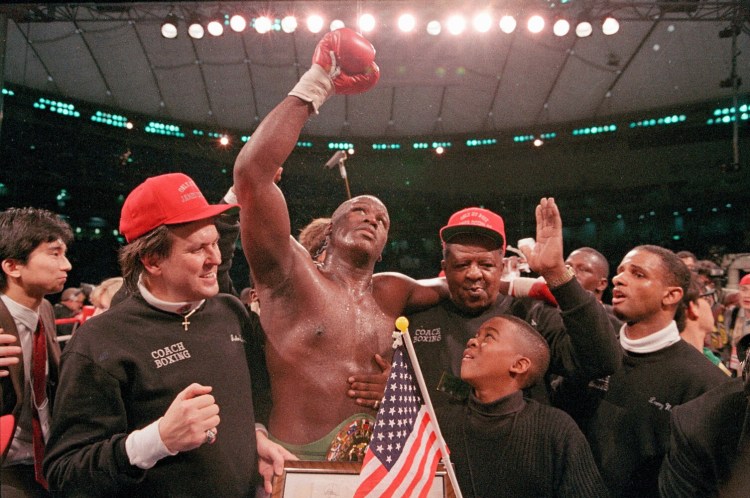 On Feb. 11, 1990, James "Buster" Douglas celebrated with a cheering crowd following a 10th round knockout victory over Mike Tyson at the Tokyo Dome.