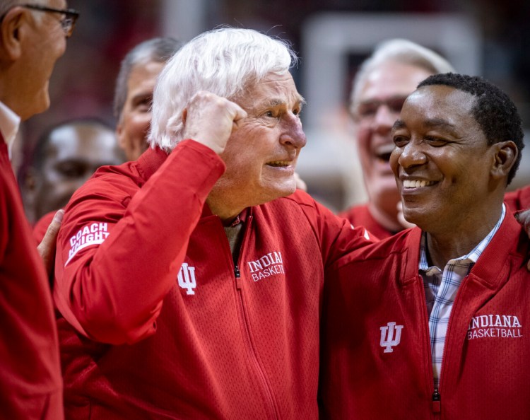 Former Indiana basketball coach Bobby Knight, left, makes his first appearance at Indiana University since his dismissal in September of 2000. Knight, along with former player Isiah Thomas, right, are on the court during a ceremony with the Indiana players of the 1980 Big Ten championship team Saturday in Bloomington, Ind. 