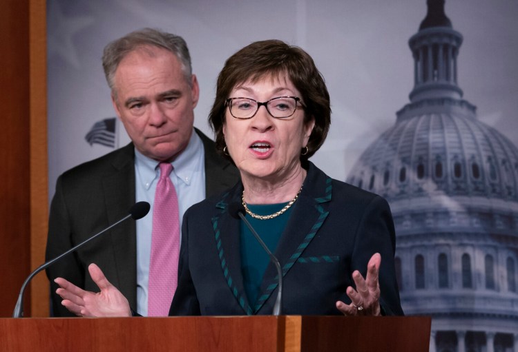 Sen. Susan Collins, R-Maine, joined at left by Sen. Tim Kaine, D-Va., speaks to reporters Thursday at the Capitol after the Senate advanced a bipartisan resolution asserting that President Trump must seek approval from Congress before engaging in further military action against Iran.