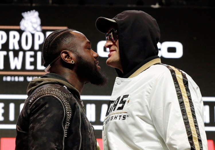 Tyson Fury, of England, right, and Deontay Wilder meet Saturday in a WBC heavyweight championship match in Las Vegas. 
