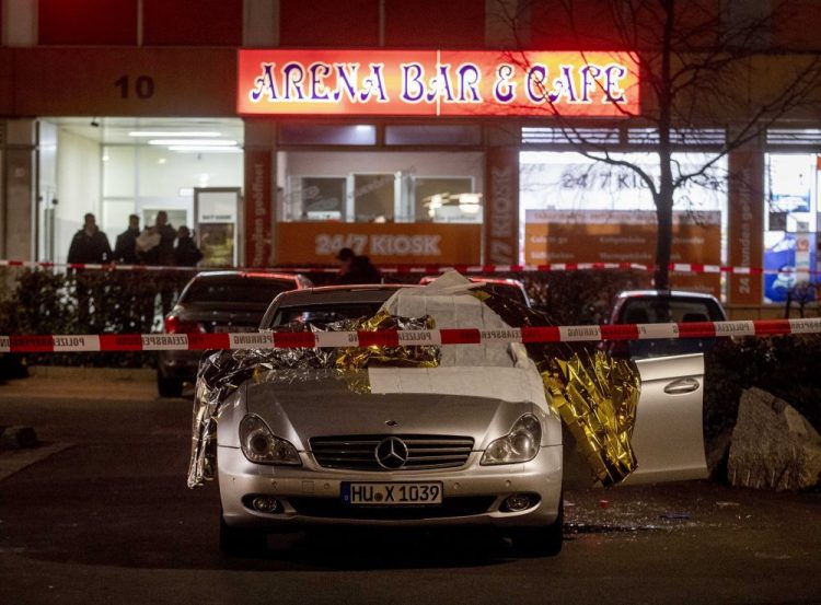 A car with dead bodies stands in front of a bar in Hanau, Germany, on Thursday.

