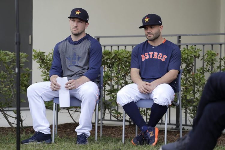 Houston Astros infielder Alex Bregman, left, and teammate Jose Altuve wait to deliver statements during a news conference before the start of the first official spring training baseball practice on Thursday morning.