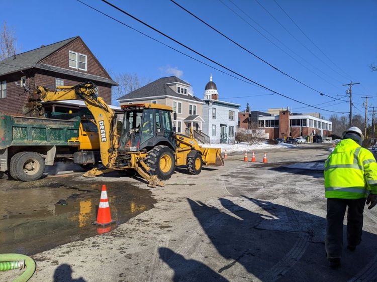 Crews with the Greater Augusta Utility District repair a water main break Friday morning on Columbia Street in Augusta. 