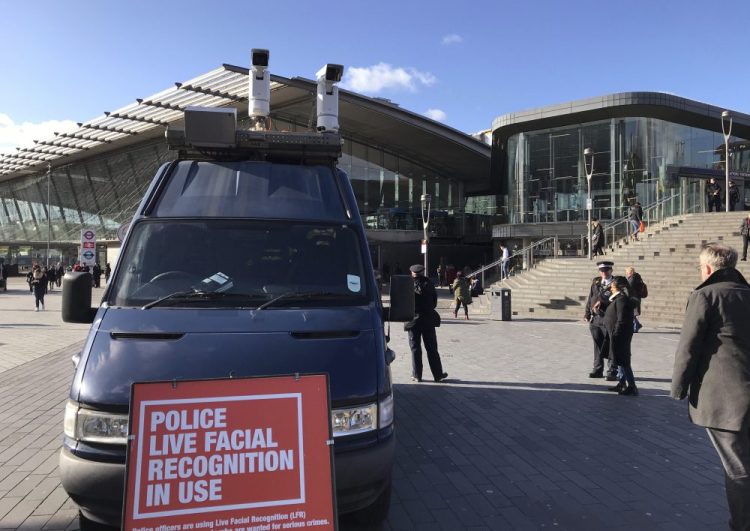 A mobile police facial recognition facility is parked outside a shopping center on Tuesday in London. “We don't accept this. This isn't what you do in a democracy," said Silkie Carlo, director of privacy campaign group Big Brother Watch, who are demonstrating against the surveillance.  London police started using facial recognition surveillance cameras  on Tuesday to automatically scan for wanted people. Kelvin Chan/Associated Press