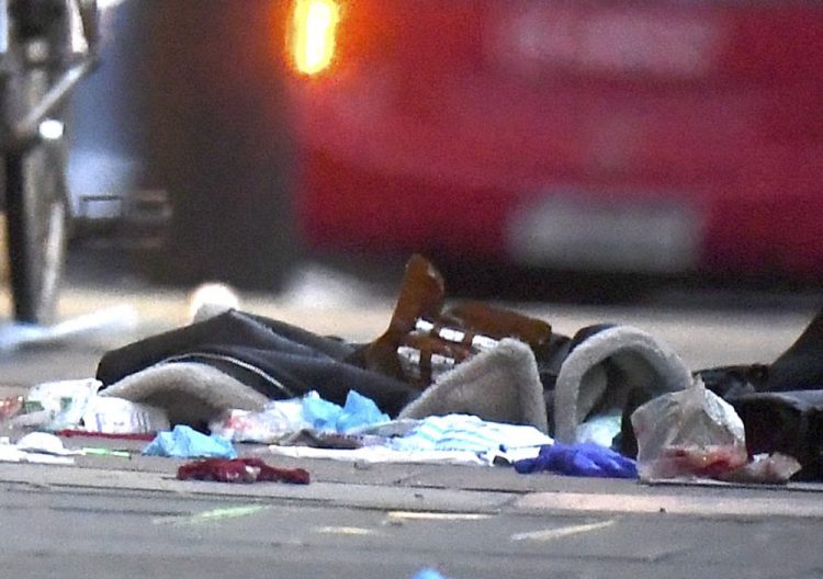 Items remain on the pavement near the scene of a stabbing incident on Streatham High Road in London on Sunday.