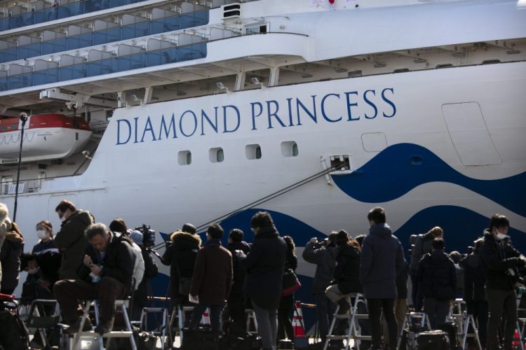 Media gather outside the quarantined Diamond Princess cruise ship in Yokohama, near Tokyo. 