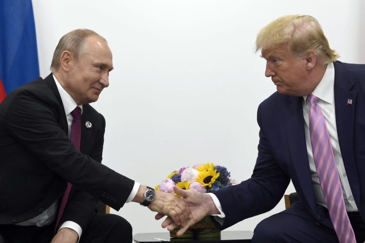 Trump, right, shakes hands with Russian President Vladimir Putin, left, during a bilateral meeting on the sidelines of the G-20 summit in Osaka, Japan, in June 2018. 