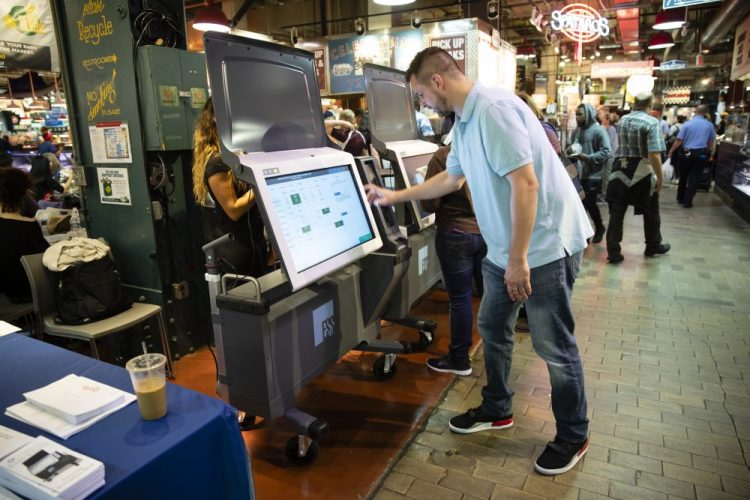 Steve Marcinkus, an Investigator with the Office of the City Commissioners, demonstrates the ExpressVote XL voting machine at the Reading Terminal Market June 13, 2019, in Philadelphia.