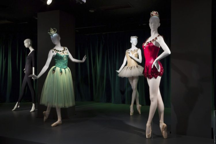 This photo provided by The Museum at FIT shows a black cotton/Lycra spandex knit unitard, circa 1980, by Bonnie August for Danskin, and Barbara Karinska's “Emeralds,” “Diamonds,” and “Rubies” costumes from "Jewels," originals designed in 1967, that are part of the new exhibit at the Fashion Institute of Technology in New York. The exhibit features 90 items, including ballet costumes, high fashion and athletic wear, or what we call today "athleisure." 