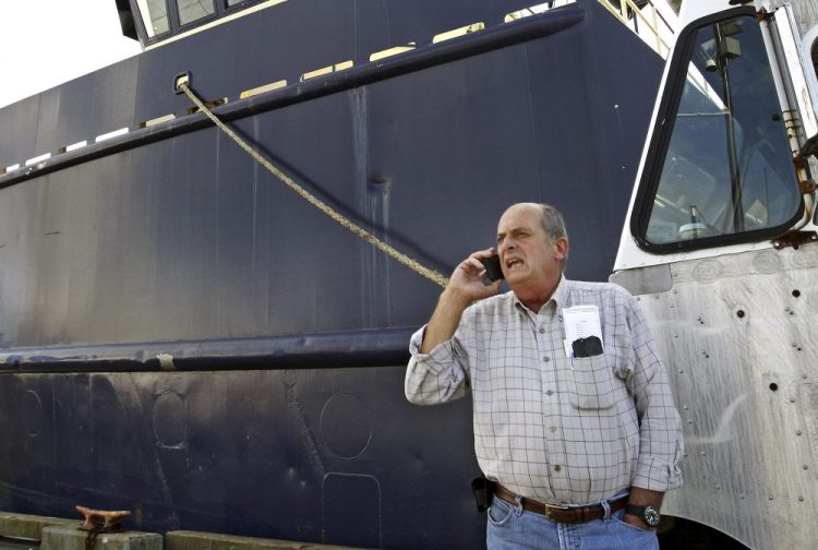 Carlos Rafael  at Homer's Wharf near his herring boat F/V Voyager in New Bedford, Mass. in 2014.
