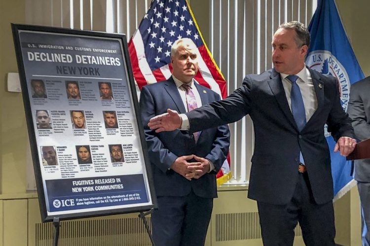 Matthew Albence, right, the acting director of U.S. Immigration and Customs Enforcement, speaks during a news conference Friday in New York. The country's top immigration official blamed the "sanctuary policies" of New York City on Friday for the sexual assault and killing of a 92-year-old woman, while the mayor's office decried such rhetoric as "fear, hate and attempts to divide." 