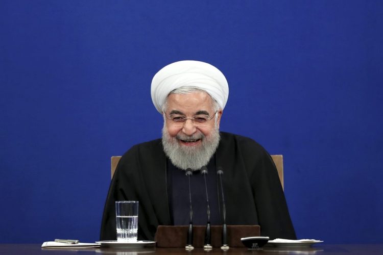 Iran's President Hassan Rouhani smiles during a press conference Sunday in Tehran, Iran.