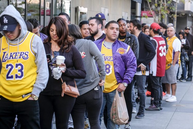 Fans line up to get into the Staples Center to attend a public memorial for former Los Angeles Lakers star Kobe Bryant and his daughter, Gianna, in Los Angeles, Monday, Feb. 24.