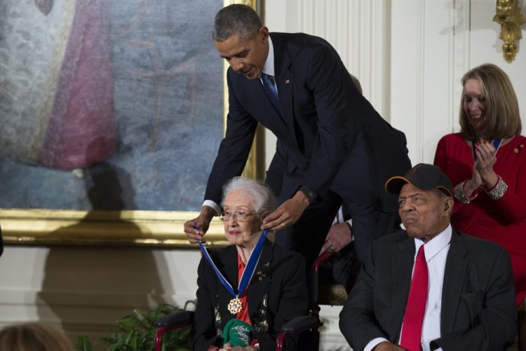 President Barack Obama presents the Presidential Medal of Freedom to NASA mathematician Katherine Johnson during a ceremony Nov. 24, 2015, in the East Room of the White House, in Washington. Johnson, a mathematician on early space missions who was portrayed in film "Hidden Figures," about pioneering black female aerospace workers, died Monday.