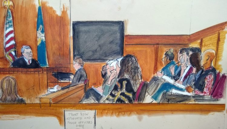 Judge James Burke, left, instructs the jurors before they begin deliberating on Harvey Weinstein's rape trial, Tuesday, Feb. 18, 2020, in New York. The panel of seven men and five women heard instructions in the law from the judge before going behind closed doors to consider charges that Weinstein raped a woman in a Manhattan hotel room in 2013 and forcibly performed oral sex on another woman, TV and film production assistant Mimi Haleyi, in 2006. (Elizabeth Williams via AP)